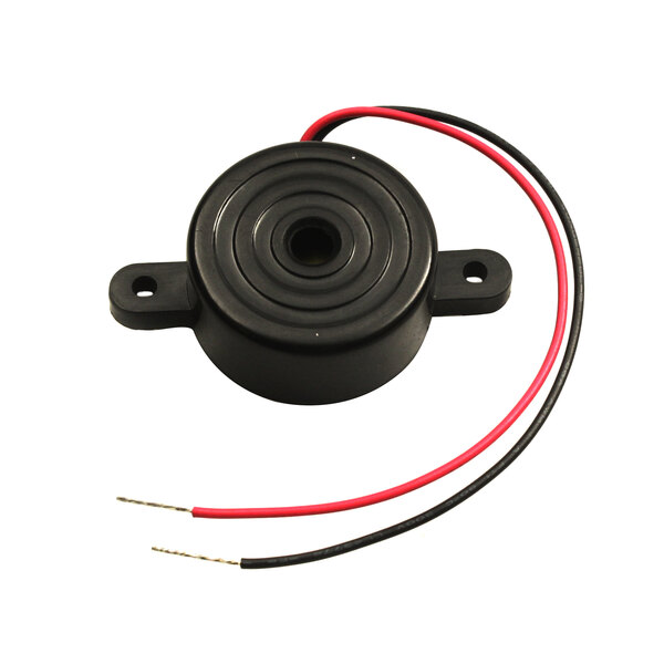 A black round object with red and black wires.