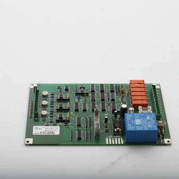 A green Alto-Shaam control board with small electronic components.