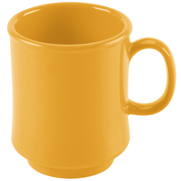 A yellow GET Diamond Mardi Gras mug with a handle on a white background.