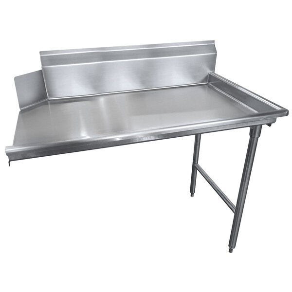 A stainless steel Advance Tabco clean dishtable on a counter.