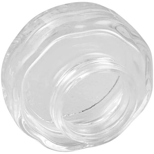A close up of a clear glass jar with a round top.