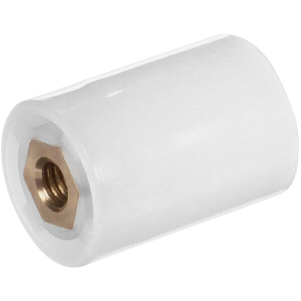 A white cylindrical object with a metal nut inside.
