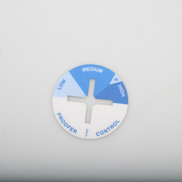 A white circular decal with a blue cross.