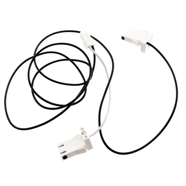A white electrical device with a black and white wire plug.
