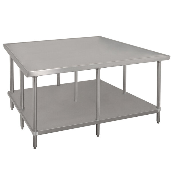 A white metal Advance Tabco stainless steel work table with undershelf.