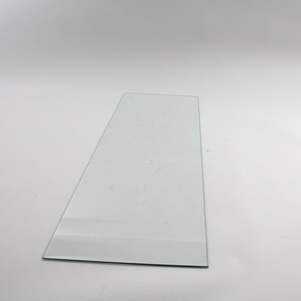 The front glass for a Master-Bilt ice cream freezer on a white surface.