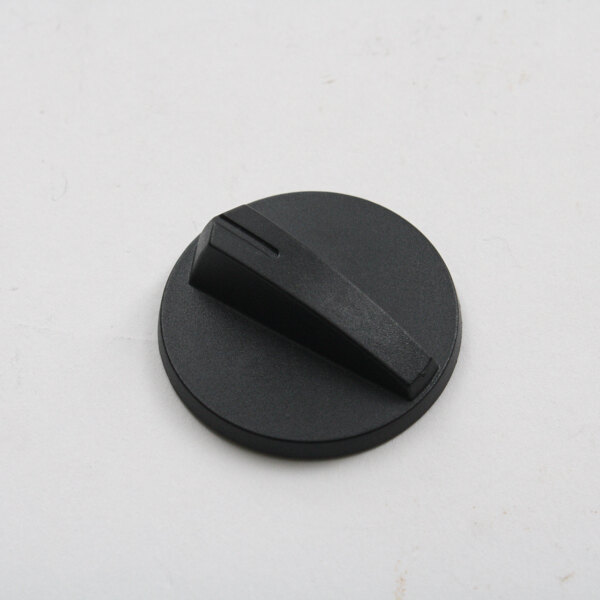 A black plastic Cadco knob on a white surface.