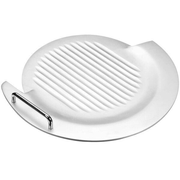 A white round plate with a metal handle.