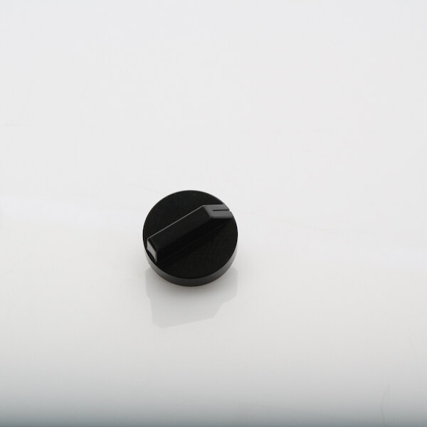 A black timer knob with a black handle on a white surface.