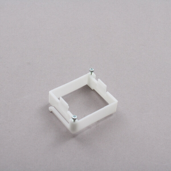 A white plastic square Doyon Baking Equipment ELM726 timer frame with screws.