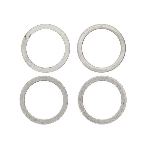 A close-up of four silver circular spacers.