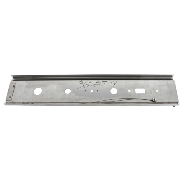 A metal side panel with holes for a Montague convection oven.