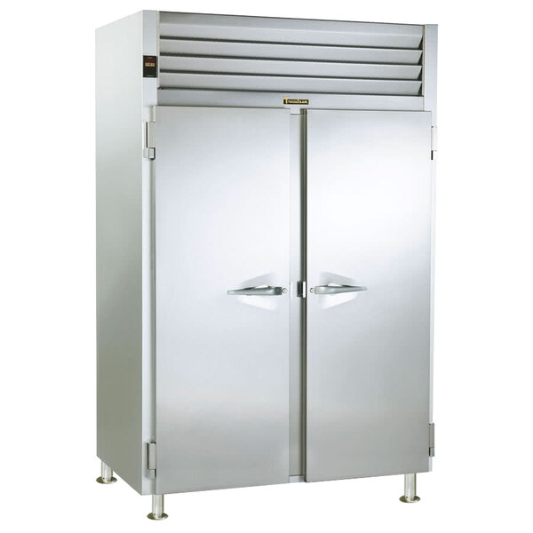 A Traulsen stainless steel holding cabinet with two white doors open.