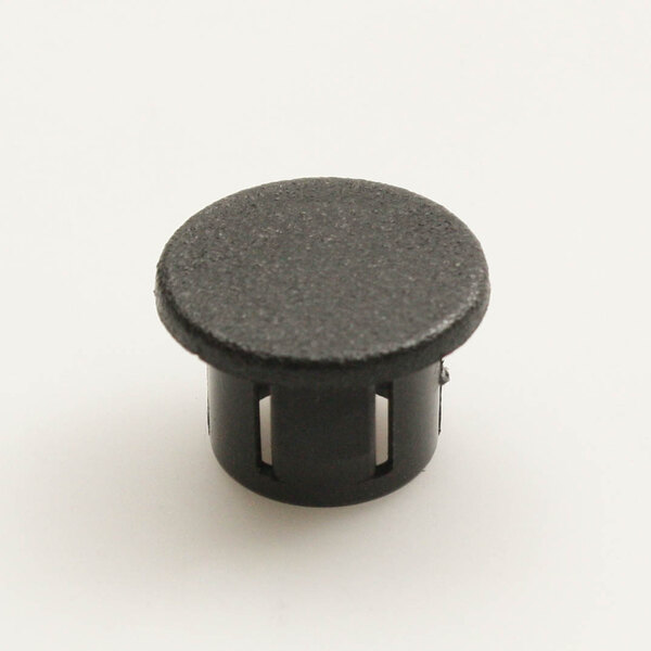 A close up of a black plastic Antunes plug with holes.