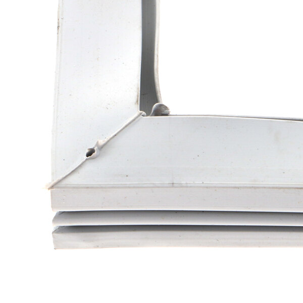 A white metal corner piece for a Food Warming Equipment door gasket.