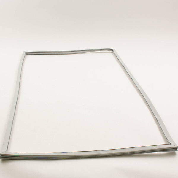 A white plastic frame with a small piece of metal on a rectangular white background.