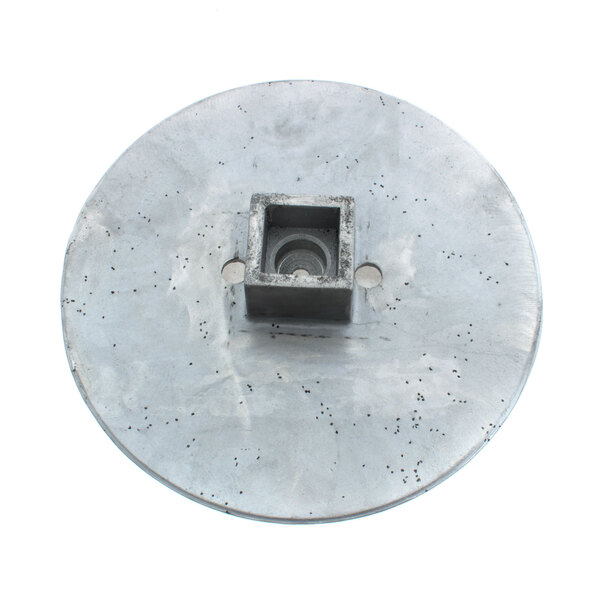 A round metal Blakeslee peel disc with a square hole in the center.