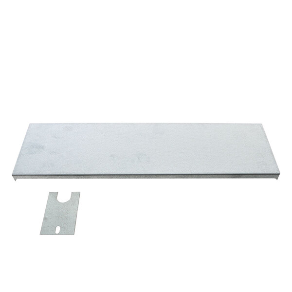 A metal plate with a piece of metal covering a metal shelf.