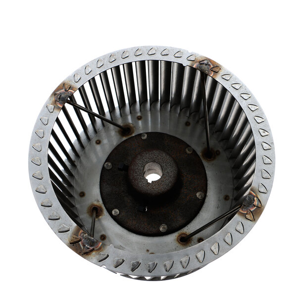 A metal Middleby Marshall blower wheel with a circular shape and holes.