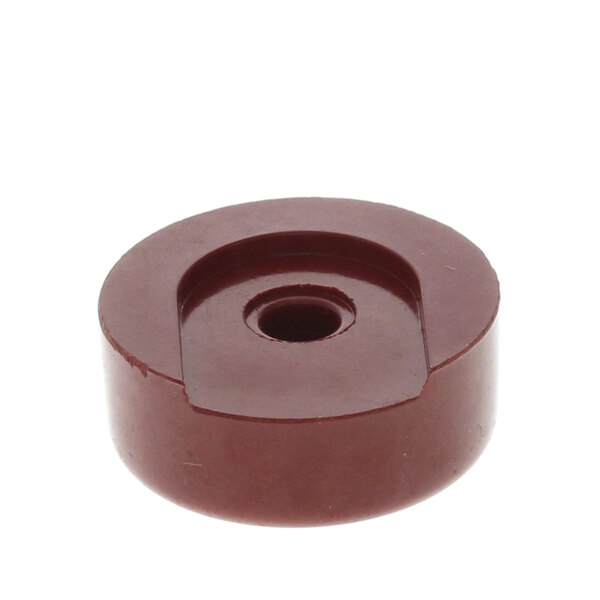 A brown plastic knob with a round hole.