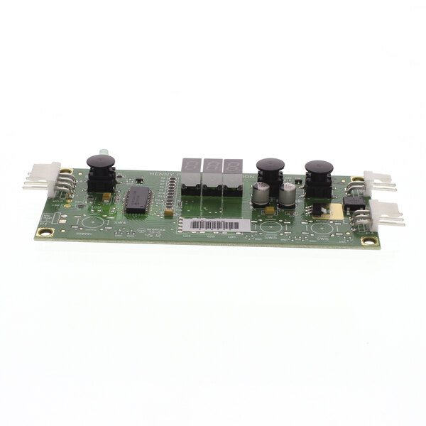 A green Henny Penny radiant heat circuit board with black and white buttons and switches.