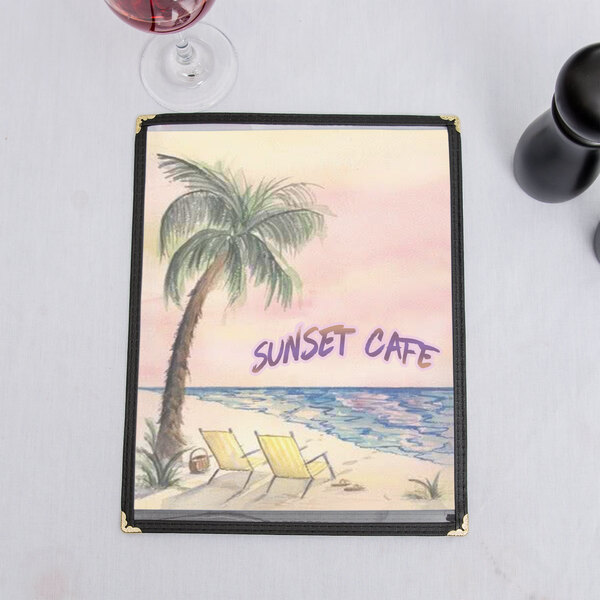 Menu paper with a tropical palm tree design and a glass of wine on a table.