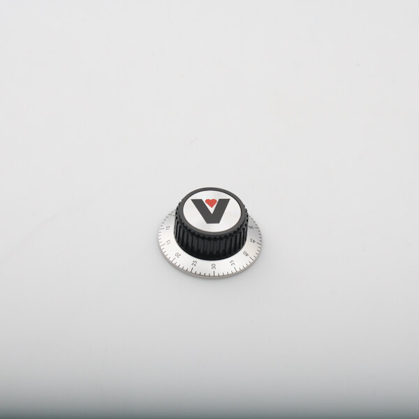 A black and white timer knob with a black and silver dial and the letter v on it.