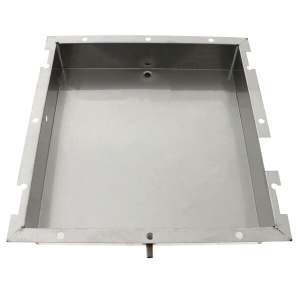 A metal tray with holes in it inside a metal box.