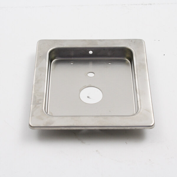 A metal square with a hole in the center.