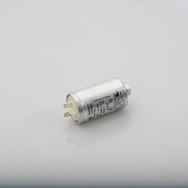 A small silver cylinder with a white capacitor on top.
