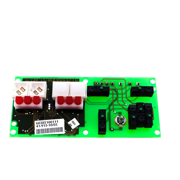 A green circuit board with red and white buttons.