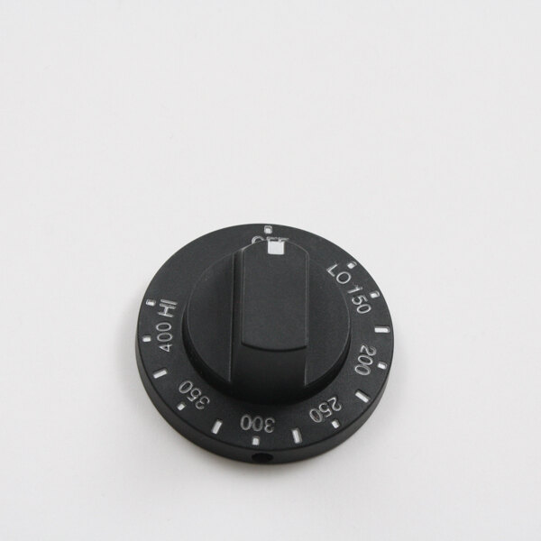 A black Bakers Pride burner knob with white text on a white background.