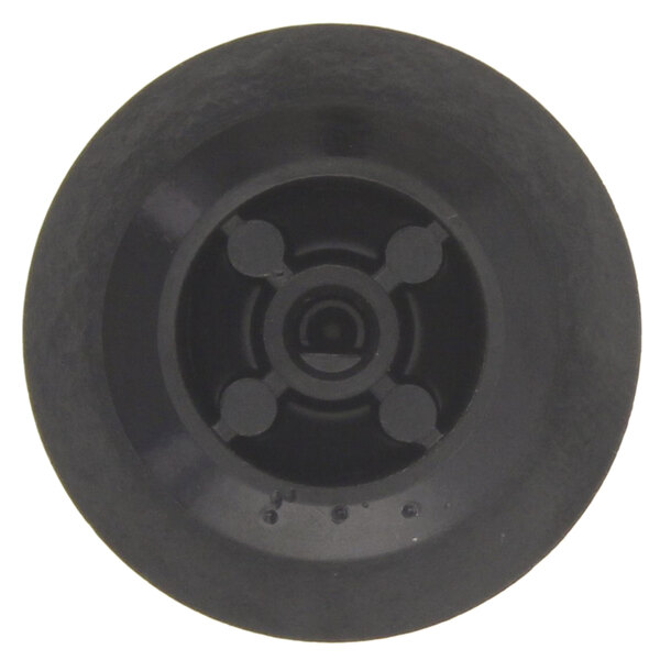 A close up of a black circular Keating thermostat knob.