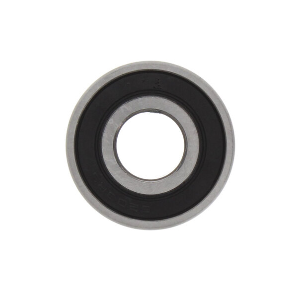 A close-up of a Robot Coupe ball bearing with black and white circles.