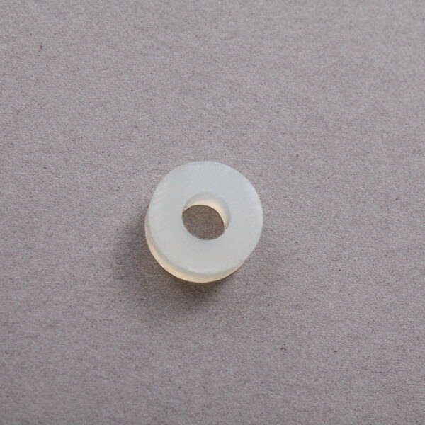 A white round Bloomfield seal on a grey surface.