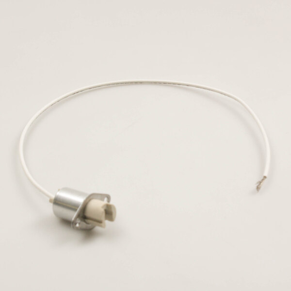 A white wire with a small metal connector attached to a metal object.