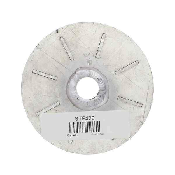 A round metal disc with a white label.