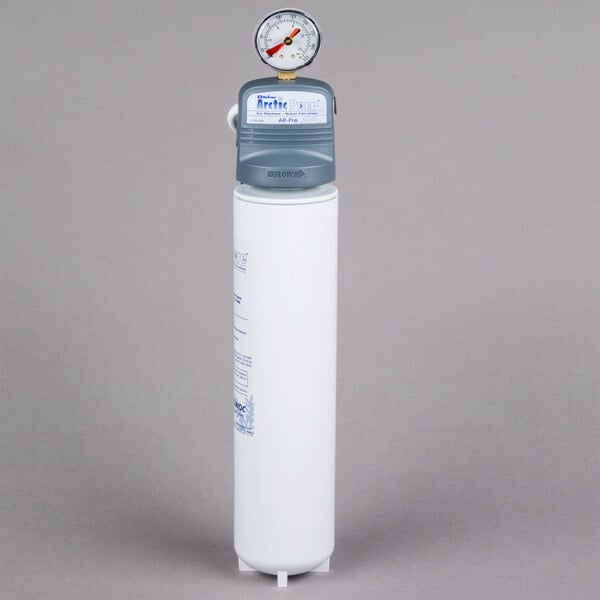 A white cylinder with a Manitowoc AR-PRE label and a gauge on top.