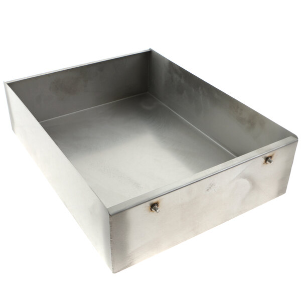 A metal tray with two handles and a hole in it.