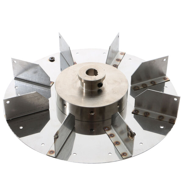 A Doyon Baking Equipment blower wheel with a metal circular object with four blades.