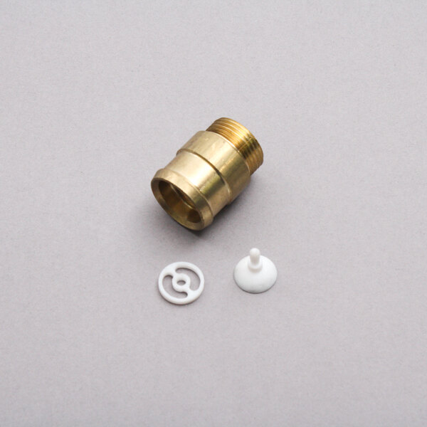 A brass fitting with a white plastic circle and a white plastic pin.