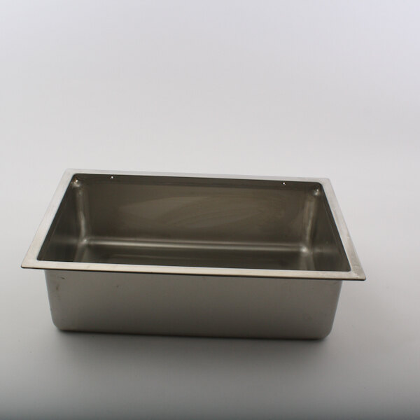A silver rectangular Wells food warmer pan without a lid on a white surface.