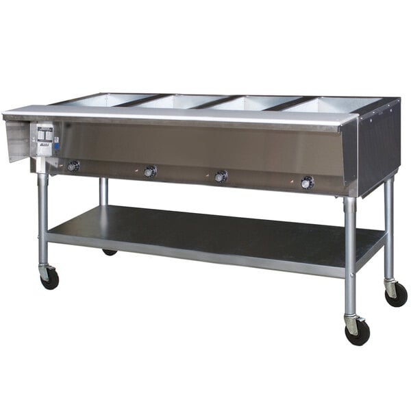 An Eagle Group portable hot food table with stainless steel containers on a counter.
