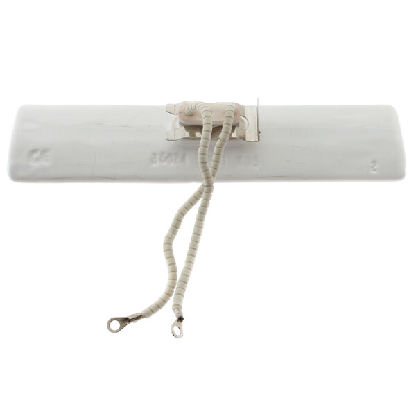 A white rectangular object with a white plastic tube and long wire attached to it.