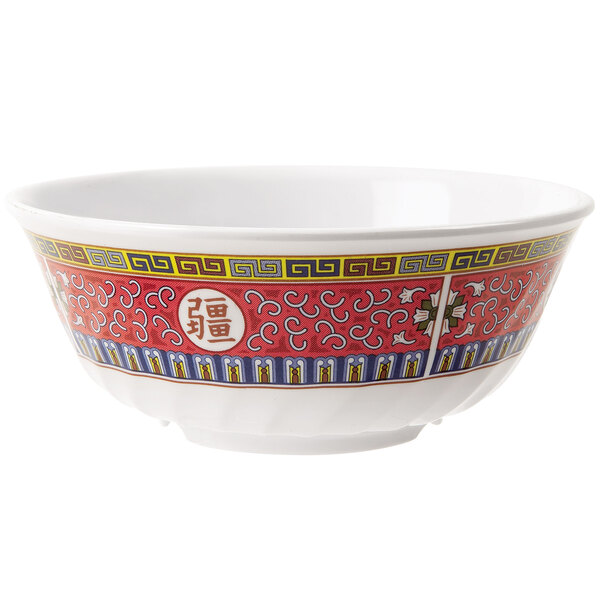 A close-up of a GET Dynasty Longevity fluted bowl with a red and yellow oriental design.