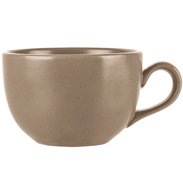 A close-up of a Libbey Driftstone sand satin matte porcelain coffee mug with a handle.