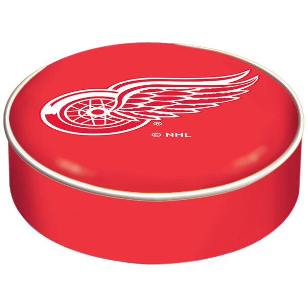 A red round Holland Bar Stool Detroit Red Wings bar stool seat cover with a white and red Detroit Red Wings logo.