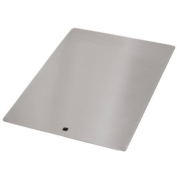 A rectangular stainless steel surface with a hole.