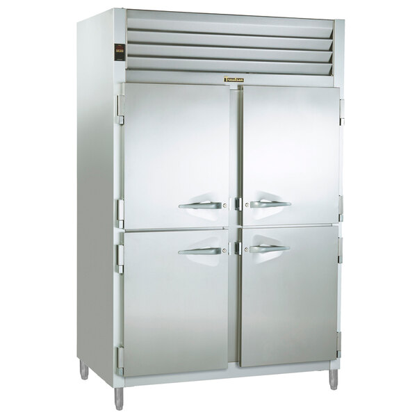 A stainless steel Traulsen refrigerator and freezer with two half doors.