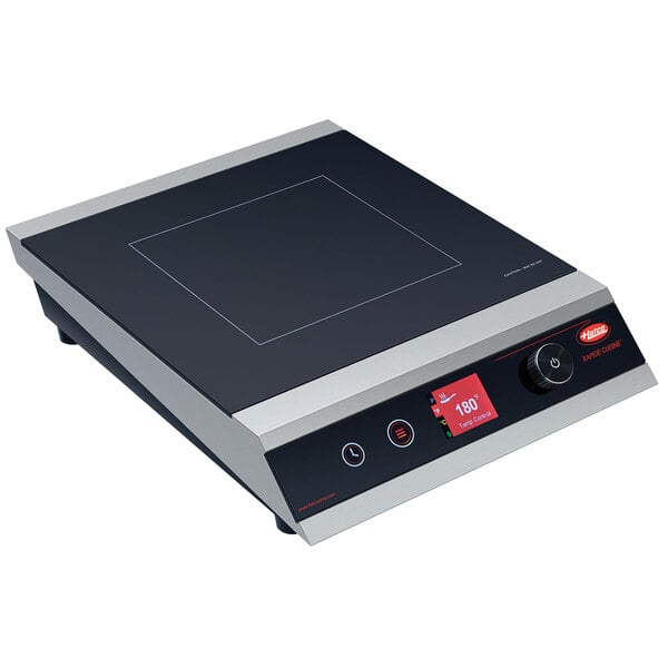 A black and silver square electronic Hatco Rapide Cuisine induction cooker.